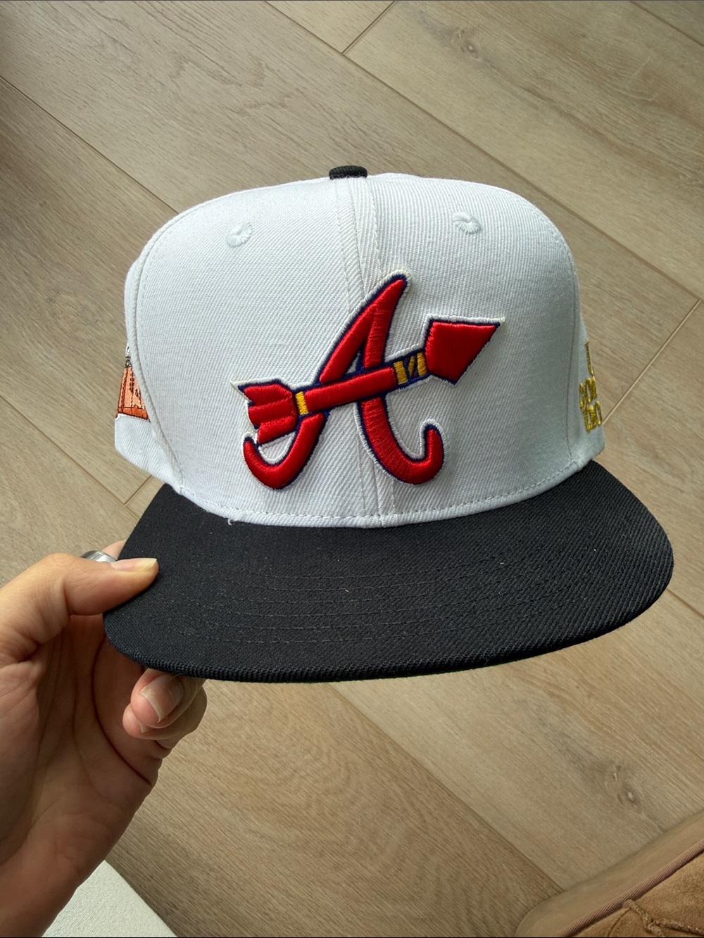 White & Black men’s Snapback Hat with Red Arrow A Logo